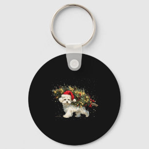 Süßer Malteser Hund in einem Weihnachtsbaum für Mä Schlüsselanhänger