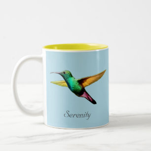 Süßer mehrfarbiger Kolibri auf Hellblau Zweifarbige Tasse