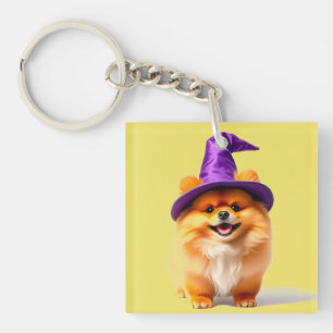 Süßer Pomeranian-Welpe mit einem Hexenhut Schlüsselanhänger