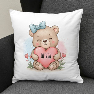 Süßer Teddybär hält rosa Herz Kissen