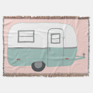 Süßer Vintage-Trailer-Camper RV auf rosa Decke