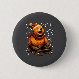 Süßer Weihnachtsbär beim Schlittenfahren im Schnee Button