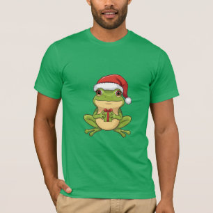 Süßer Weihnachtsfrosch mit Santa-Hut hält Geschenk T-Shirt