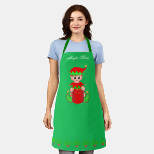 Süßer Weihnachtshelfer-Elf auf grün Schürze