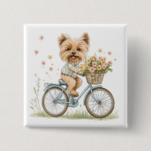 Süßer Yorkie-Hund beim Radfahren mit Frühlingsblum Button