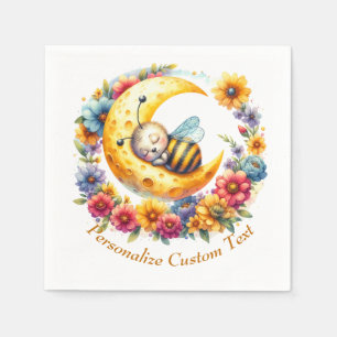 Süßes Baby Hummel schlafend auf einem Halbmond Serviette