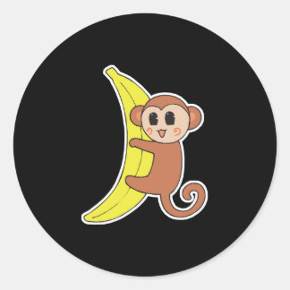 süßes Babyäffchen auf Banane Runder Aufkleber