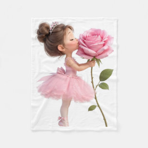 Süßes Ballerina-Mädchen, das eine riesige rosa Ros Fleecedecke