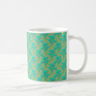 Süßes Blumenmuster in Türkis auf Grün Tasse