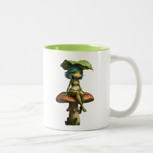 Süßes Froschmädchen sitzt auf einem Pilz Zweifarbige Tasse