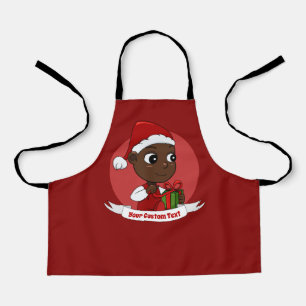 Süßes Weihnachtsbaby mit einem Geschenk und Santas Schürze
