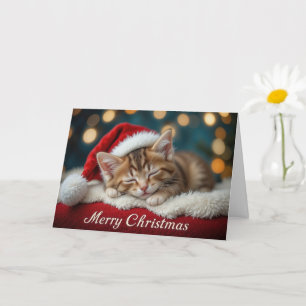 Süßes Weihnachtskitten mit roter festlicher Santa- Karte