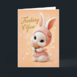 Sweet Baby Bunny in Peach Dress Thinking of You Karte<br><div class="desc">This delicate “Thinking of You” card features an adorable baby bunny dressed in a soft pink knit bonnet and dress, holding a tiny bouquet of flowers. Warm peach tones and gentle details create a comforting, heartfelt design perfect for lifting someone’s spirits, offering support, or simply letting them know they’ve been...</div>