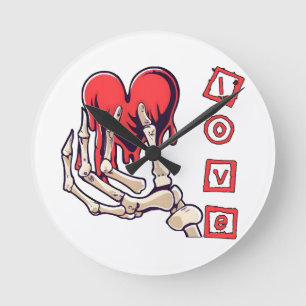 Symbolische Liebesskelett-Hand, die Herz anbietet Runde Wanduhr