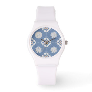 Symmetrisches Orange-Blume getechtes Muster auf bl Armbanduhr
