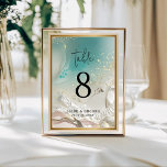 Table Number | Ethereal Shoreline Teal Ocean Tischnummer<br><div class="desc">Complete your reception decor with the Ethereal Shoreline Teal Ocean Tide wedding table number. Featuring a striking deep turquoise and seafoam green watercolor wash with delicate gold-look splatters, this double-sided card brings the beauty of the sea to your guest tables. The clean, minimalist typography ensures that table numbers are easy...</div>
