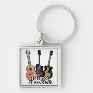 Talent seit Geburt. Vintage bunt Gitarre Schlüsselanhänger