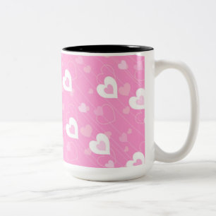 Tasse aus rosa und weißem Herzen
