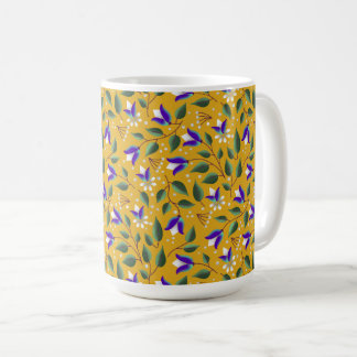 Tasse der Blüten in Gelb und Lila