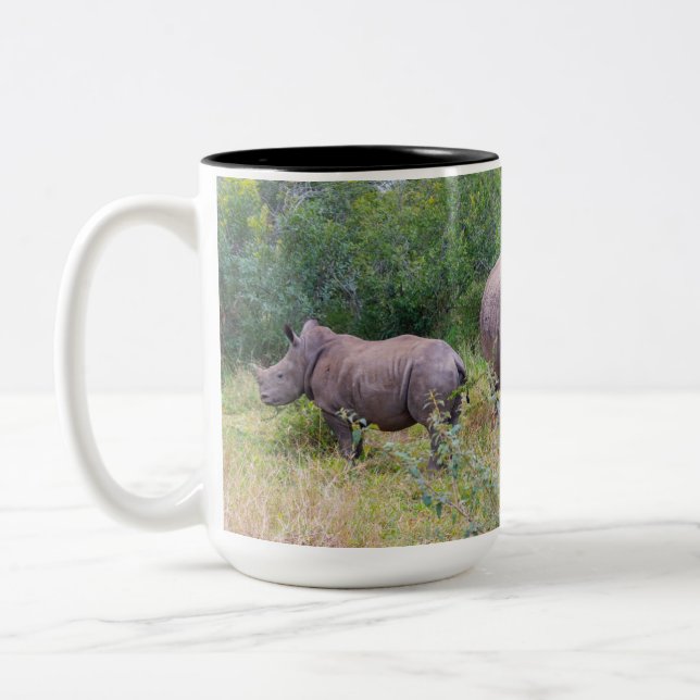 Tasse der Muttermilch und der gebleiblichen Rhino (Links)