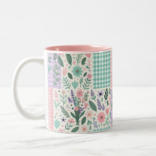 Tasse der Vintagen Blumen- und Prüfmuster