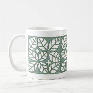 Tasse des grünen und weißen Blattes