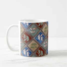 Tasse des Kaffees mit Gingko-Blattdesign