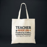 Teacher Mode On style quotes Tragetasche<br><div class="desc">A motivational teacher-themed design celebrating the dedication and passion educators bring to their classrooms every day. Featuring the phrase “Teacher Mode On – Fueled by Coffee, Guided by Passion” with charming icons like coffee, books, a lightbulb, and a pencil, this design highlights the energy, creativity, and commitment teachers put into...</div>