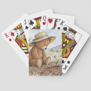 Teddybär starrt auf eine wachsende Margerite Spielkarten