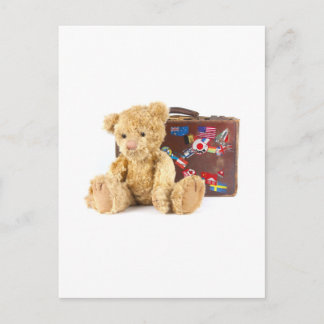 Teddybär und Vintager alter Koffer mit Weltstar Postkarte