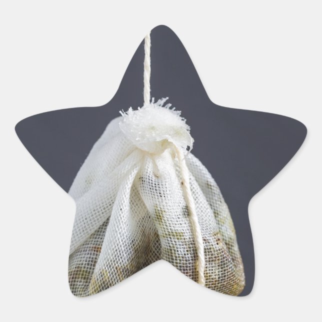 Teebeutel hängt in einer Tasse Stern-Aufkleber (Vorderseite)