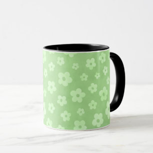 Teetasse mit schwarzem Griff, grün-weiße Blume