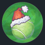Tennis Ball Christmas Green Runder Aufkleber<br><div class="desc">Festlicher Tennisball in Weihnachtsmannmütze mit Weihnachten Grün Hintergrund Urlaubsornamente, Geschenke und Dekorationen bieten unsere originale Tennisball-Kunst, die alle für die Ferien in einer roten Weihnachtsmannmütze vor einem grünen Hintergrund mit unserer charakteristischen Textur verziert ist. Unser Freizeitsportdesign ist perfekt für alle, die Lieben Tennis spielen und für den Urlaub dekorieren. Viel...</div>
