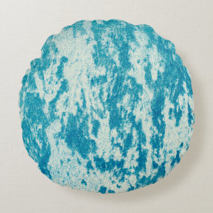Texturierter blauer Hintergrund aus dichtem Stoff. Rundes Kissen