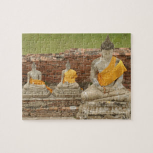 Thailand, Ayutthaya. Statuen des Sitzhaushalts Puzzle