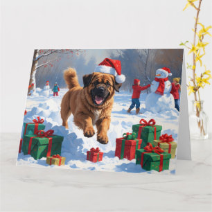 Tibet-Mastiff läuft im Schnee mit Weihnachtshut Karte