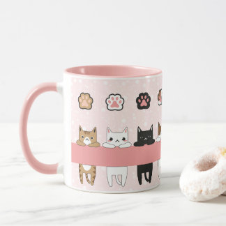 Tiernos gatitos en fondo rosa con flores tasse