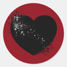 Tinte schwarzes Herz geplasht. Runder Aufkleber