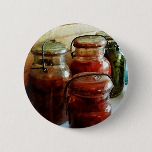 Tomaten und Schnur-Bohnen in einmachenden Gläsern Button