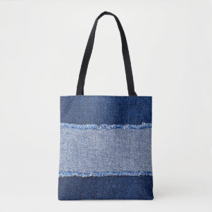 Torn denim: blauer Jeans Stoff.