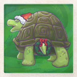 Tortoise in der Weihnachtsmannmütze auf grün Glasuntersetzer