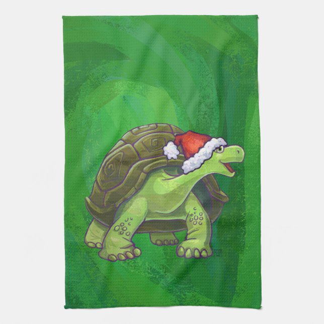 Tortoise in der Weihnachtsmannmütze auf grün Handtuch (Vertikal)