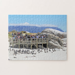 Touristen am Flussstein-Strand, der Pinguine Puzzle
