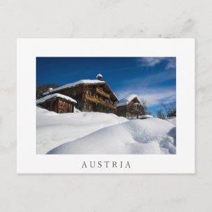 Traditionelle Holzhütten im Schnee Postkarte