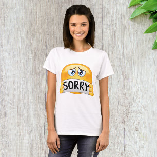 Trauriges Sorry Emoji Gesicht hält Entschuldigungs T-Shirt