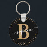 Trendy Girly Black Name Script Mit Monogramm Schlüsselanhänger<br><div class="desc">Girly, elegant, trendy, modern, schwarz und gold, monogramm Initialname Skript benutzerdefinierte personalisierte mit Monogramm Schlüsselanhänger. Mit einem Monogramm-Initial- und einem gürtelhaften Namensskript in einem handgeschriebenen Kalligraphie-Schwanz-Schriftart und einem gepunkteten Kreisrahmen um Ihr Monogramm. Perfektes weibliches Geschenk für Schwesterin, Mutter, Freundin, Geburtstag, Hochzeit, Brautparty, süße 16 Geburtstagsparty, oder alle, die Lieben hübsche...</div>