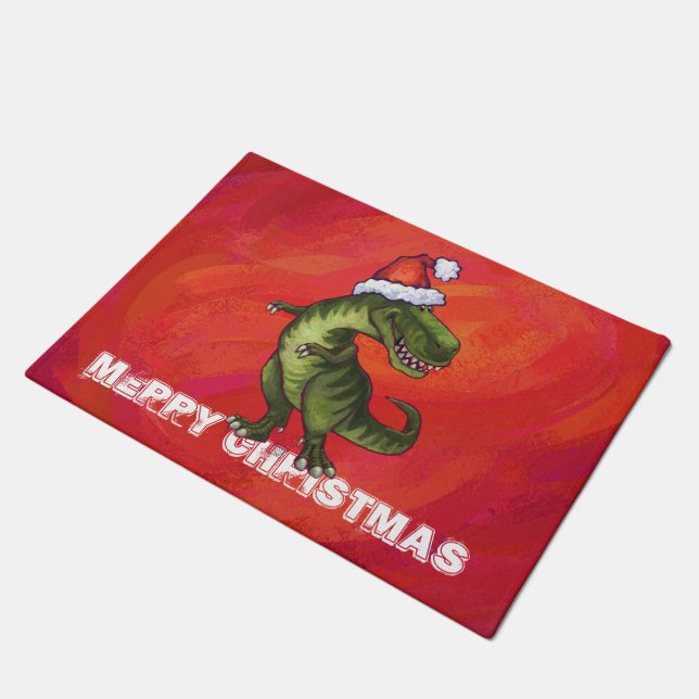 TRex Dino in Weihnachtsmannmütze auf Rot Fußmatte (Schrägansicht)