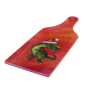 TRex Dino in Weihnachtsmannmütze auf Rot Schneidebrett
