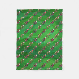 TRex in Weihnachtsmannmütze auf Grün Fleecedecke