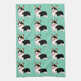 Tricolor Corgis in hellgrünem Geschirrtuch